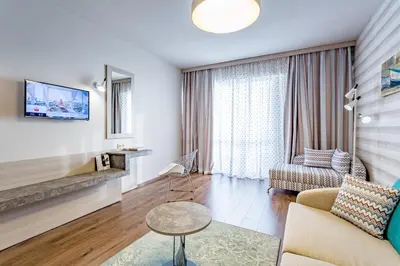 a living room with a couch and a table at HI Hotels Imperial Resort - Ultra All Inclusive, FREE PARKING in Sunny Beach