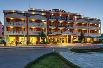 a large building with a parking lot in front of it at Sunny Beach Hotel Forum - All Inclusive in Sunny Beach