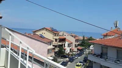 a view of a city street with buildings and cars at ORION Guest House in Sozopol