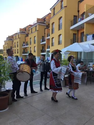 a group of people playing music on a street at Serena Residence Aparthotel in Sozopol
