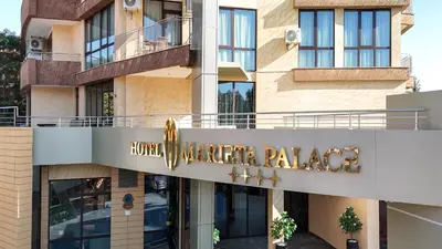 a building with a sign that reads hotel americanaza at Marieta Palace Hotel in Nesebar