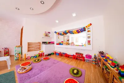a living room with a large purple rug in a room at Grand Resort in Sveti Vlas