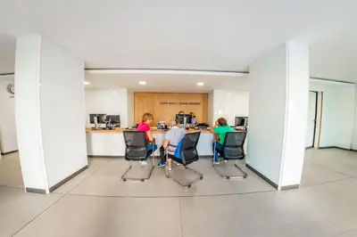 a group of people sitting in chairs in a kitchen at Grand Resort in Sveti Vlas