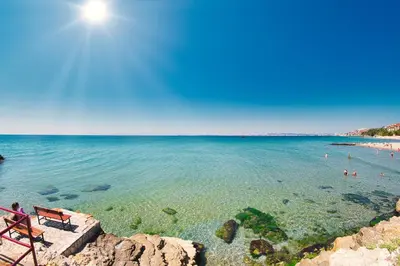 a view of a beach with people in the water at Grand Resort in Sveti Vlas