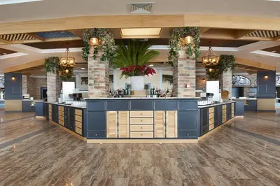 a large lobby with a large island in a building at Paradise Beach Residence - Ultra All Inclusive in Sveti Vlas