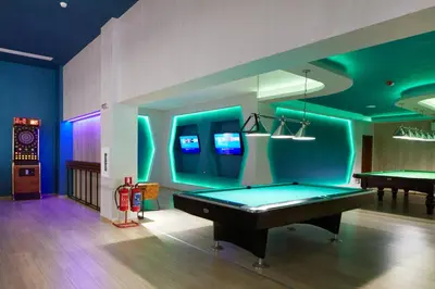 a billiard room with a pool table and a pool table at Paradise Beach Residence - Ultra All Inclusive in Sveti Vlas