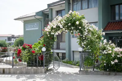 a bunch of flowers on a fence in front of a building at Gardenia Vacation Settlement in Sozopol