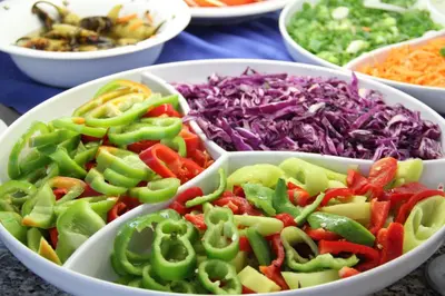 a group of bowls filled with different types of vegetables at Smartline Meridian Hotel in Sunny Beach