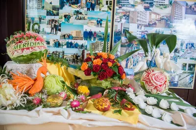 a display of vegetables and flowers on a table at Smartline Meridian Hotel in Sunny Beach