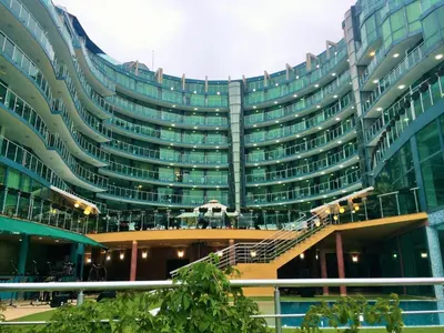 a large building with stairs in front of it at Hotel Primorsko Del Sol in Primorsko
