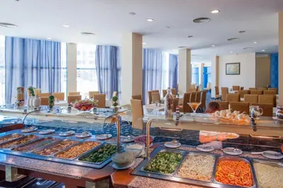 a buffet line with many different types of food at Hotel Primorsko Del Sol in Primorsko