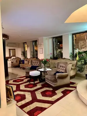 a large living room with couches and a rug at Hi Boutique Hotel in Varna City