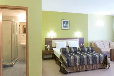 a hotel room with a bed and a sink at Regata Palace Hotel in Sunny Beach