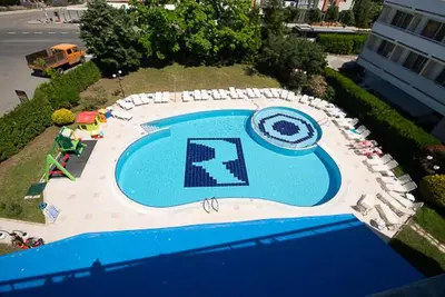 an overhead view of a swimming pool with chairs around it at Regata Palace Hotel in Sunny Beach
