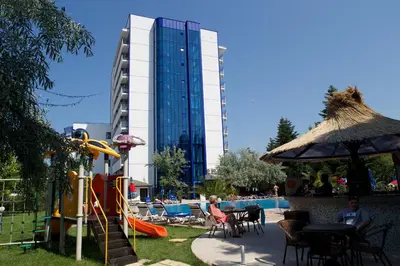 a resort with a pool and a building with a slide at Dunav Hotel in Sunny Beach