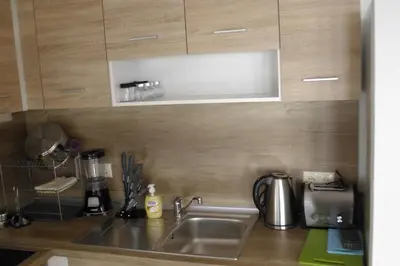a kitchen with a sink and a counter top at TOP CENTER , MODERN AND QUIET APARTMENT in Burgas City