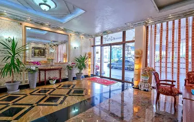 a large room with a table and a mirror at Karolina Hotel in Sunny Beach