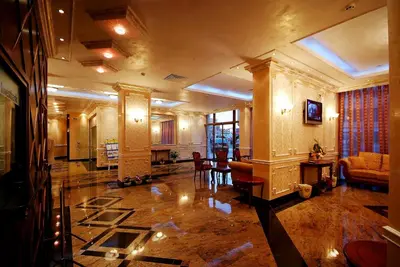 a large lobby with a couch and a table at Karolina Hotel in Sunny Beach