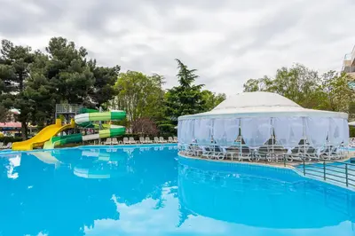 a swimming pool with a gazebo and slides at a water park at iHotel Sunny Beach in Sunny Beach