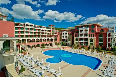an aerial view of a resort with a pool and chairs at Saint George Palace Hotel All-inclusive in Sveti Vlas