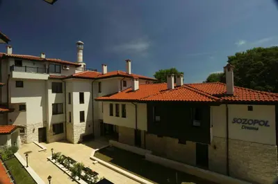 a group of buildings with red tile roofs at Sozopol Dreams Apartments in Sozopol