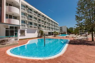 a large swimming pool in front of a building at Zefir Hotel in Sunny Beach