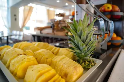 a tray of food with a pineapple on top of it at MPM Hotel Arsena - Ultra All Inclusive in Nesebar