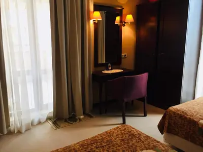 a hotel room with a sink and a mirror at Barcelo SeaView Apartment in Sunny Beach