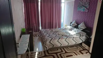 a small bedroom with a bed and a bath tub at Apartment Sianie в центъра на Слънчев бряг, само на няколко крачки от плажа in Sunny Beach