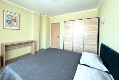 a bedroom with a bed and a large closet at Evi Apartments 2 in Pomorie