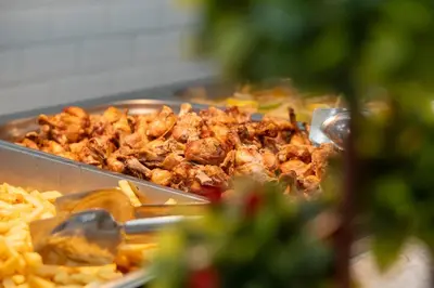 a tray of food with french fries and meat at MPM Hotel Orel - Ultra All Inclusive in Sunny Beach