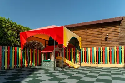 a playground with a slide in front of a building at MPM Hotel Orel - Ultra All Inclusive in Sunny Beach