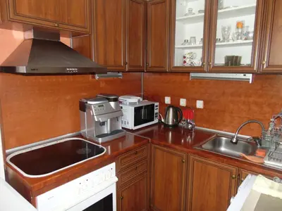 a kitchen with a sink and a microwave at Burgas Central Aleksandrovska in Burgas City