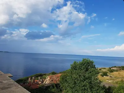 a view of a body of water with the ocean at Guest House Evtimov in Primorsko