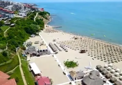 an aerial view of a beach with a lot of chairs at Sirena Appartment in Sveti Vlas