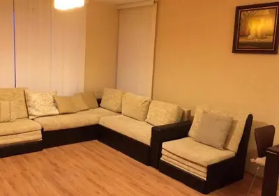 a living room with a couch and a chair at Sirena Appartment in Sveti Vlas
