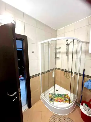 a shower with a glass enclosure in a room at Sirena Appartment in Sveti Vlas