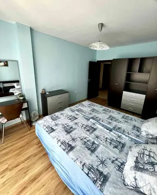 a bedroom with a bed and a desk in it at Sirena Appartment in Sveti Vlas