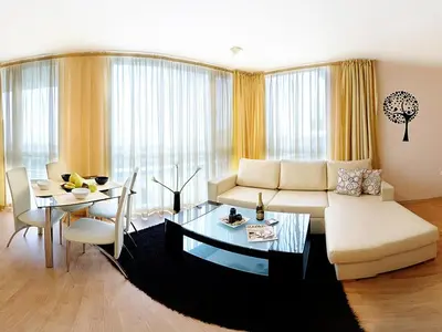 a living room with a couch and a table at Sea Dream Rental Apartments in Varna City