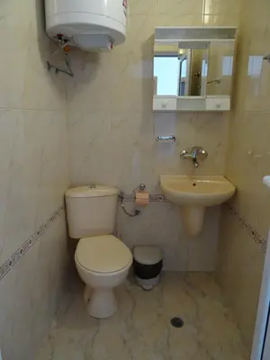 a bathroom with a toilet and a sink at Blue House in Tsarevo