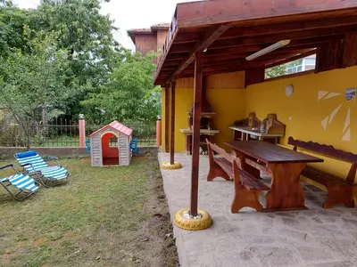 a playground with a table and a play house at Blue House in Tsarevo