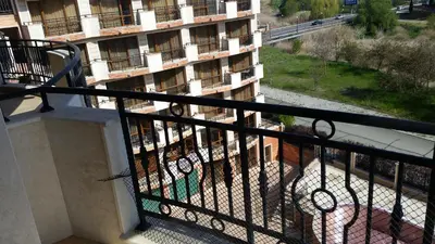 a balcony of a apartment building with a view of a building at Apartment in River Park in Sunny Beach