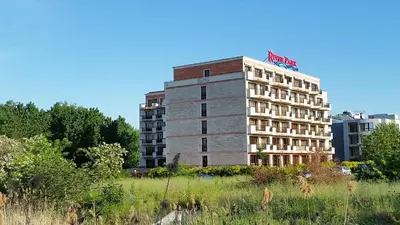a building with a sign on the top of it at Apartment in River Park in Sunny Beach
