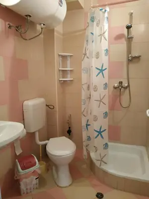 a bathroom with a toilet and a sink and a shower at CITY STAY in Varna in Varna City