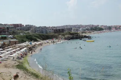 a beach with a bunch of people in the water at Barex Family Hotel in Sozopol