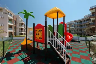 a playground with a slide in a city at Apartments Del Sol - Sunny Island Complex in Chernomorets