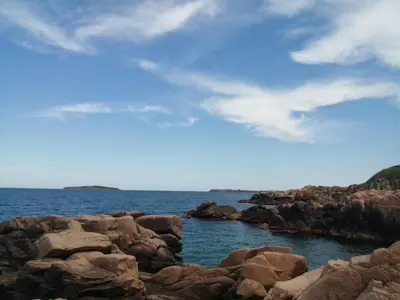 a large group of rocks in the water at Apartments Del Sol - Sunny Island Complex in Chernomorets