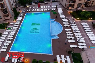 an overhead view of a large swimming pool with chairs and tables at TSB Sunny Victory in Sunny Beach
