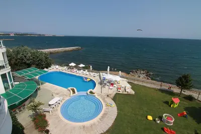 an overhead view of a swimming pool next to the ocean at Peter Hotel in Ravda