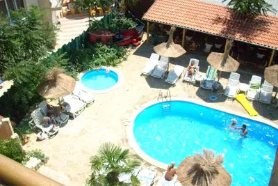 an overhead view of a swimming pool with umbrellas at Family hotel Tropicana in Ravda